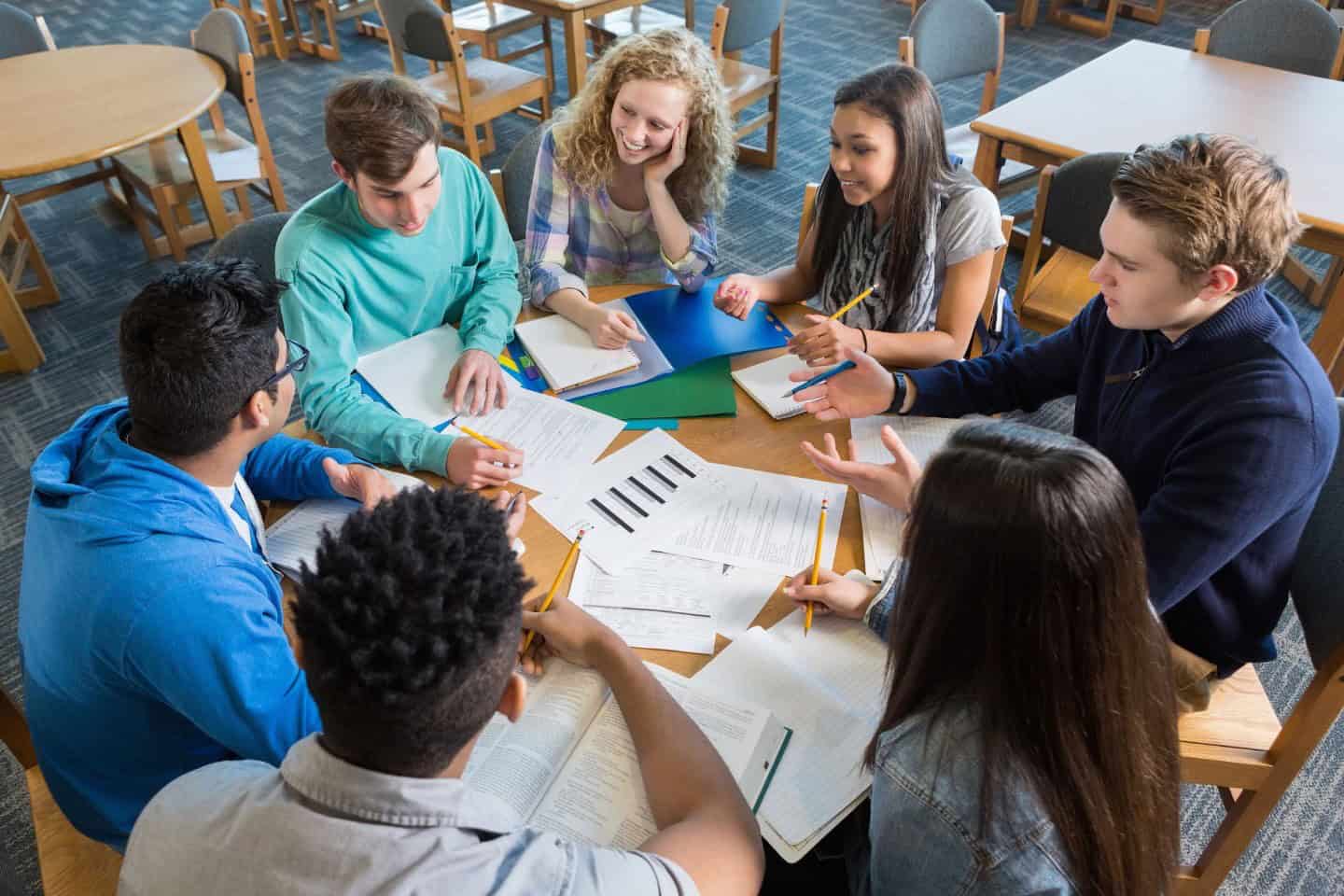 Students around a table in discussion at Blair Academy