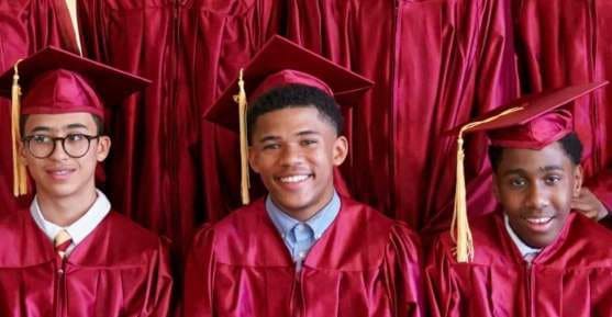 Nativity Preparatory School graduates in caps and gowns